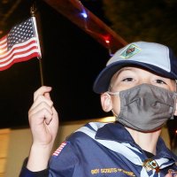 Cub Scouts and Girl Scouts waved flags during the annual parade.